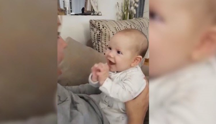 mom sings to baby